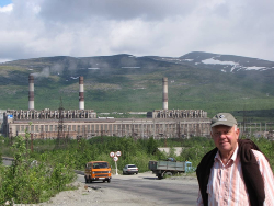 The smelter at Apatity with the author (Glasby) pictured in the foreground. The smelter complex extends a long way into the background. Only the smelter on the left is in action.
